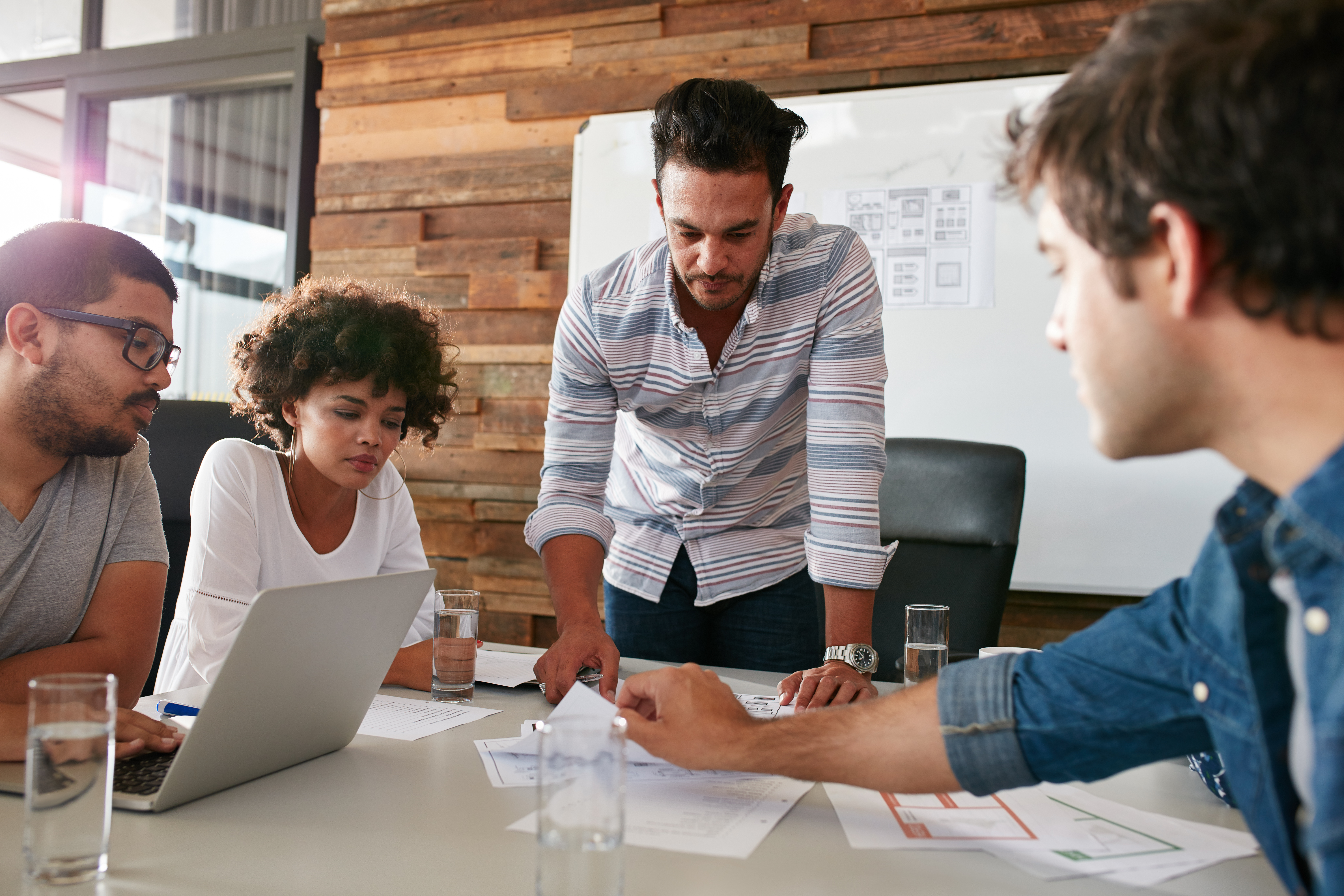 Image of a team of individuals working together to find a solution